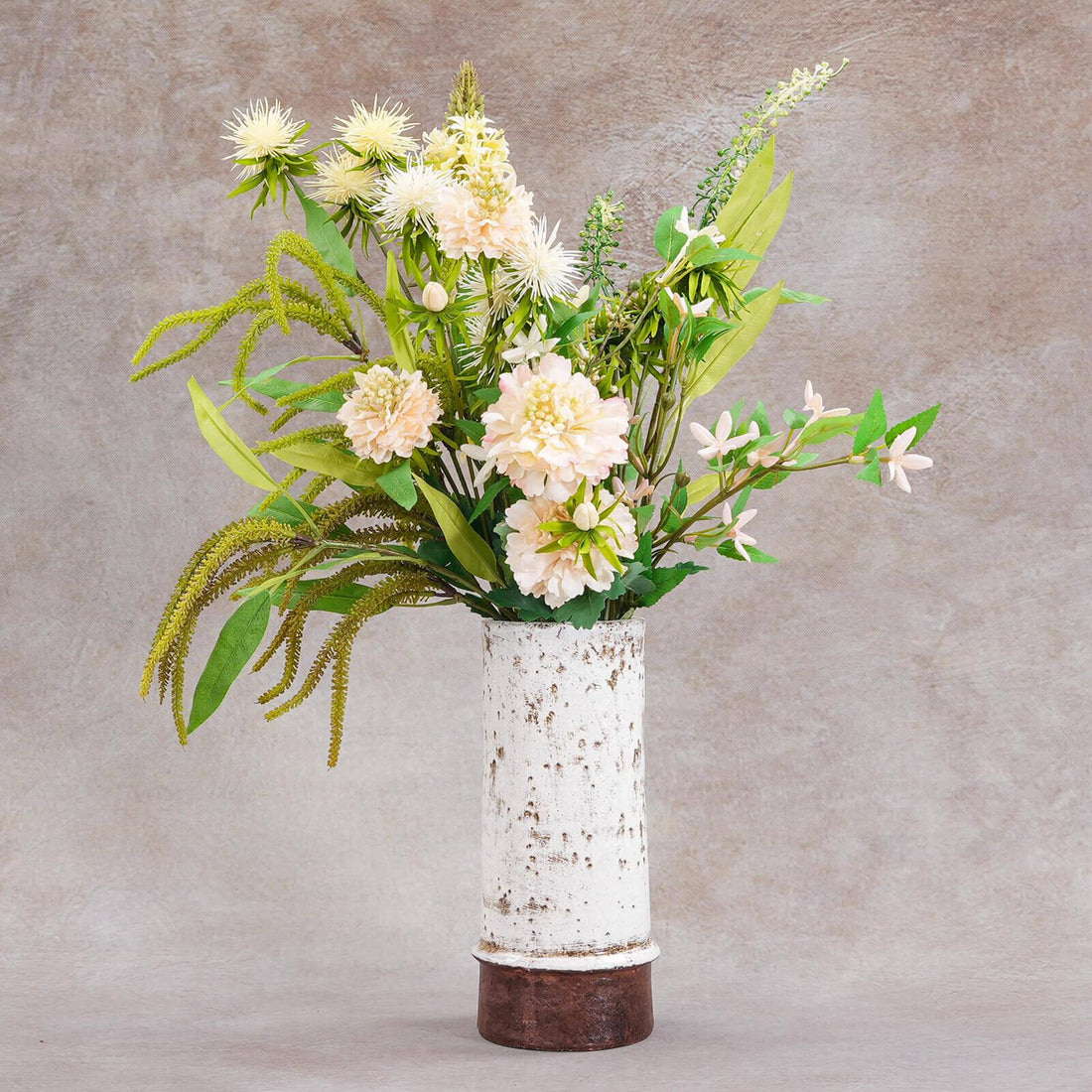 Lifelike silk floral bouquet in a decorative vase